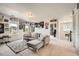 Upstairs living area featuring a gray sectional sofa, carpet and natural light at 25128 E Maple Ave, Aurora, CO 80018