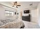 The main bedroom has a carpeted floor, fan, and black dresser at 25128 E Maple Ave, Aurora, CO 80018
