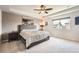 Main bedroom with soft carpet, ceiling fan, and Paris art at 25128 E Maple Ave, Aurora, CO 80018