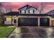 Two-story house with a landscaped yard, two-car garage, and updated exterior at 2221 Mattive Pl, Brighton, CO 80601