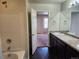 Double vanity bathroom with view into bedroom at 1211 Bistre St, Longmont, CO 80501