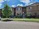 Charming townhome featuring a well-kept lawn and beautiful landscaping, perfect for suburban living at 1211 Bistre St, Longmont, CO 80501