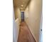 Clean hallway with closet space and natural light, enhancing the sense of space and functionality at 1211 Bistre St, Longmont, CO 80501