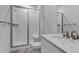 Bathroom with white tile and glass shower with marble vanity at 2089 S Fultondale Way, Aurora, CO 80018