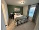 Cozy bedroom with decorative pillows, a reading lamp, and gray window drapes at 2089 S Fultondale Way, Aurora, CO 80018