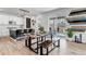 Contemporary dining area with a wooden table, benches, and a view of the outdoor deck at 2089 S Fultondale Way, Aurora, CO 80018