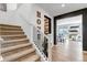 Stylish entryway featuring stairs, wood-look flooring and easy access to living spaces at 2089 S Fultondale Way, Aurora, CO 80018