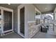 Inviting covered front porch with stylish stone accents and comfortable seating at 2089 S Fultondale Way, Aurora, CO 80018
