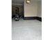 Spacious garage with epoxy flooring and access to the interior of the home at 2089 S Fultondale Way, Aurora, CO 80018