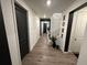 Bright hallway with modern finishes, leading to the staircase and front door at 2089 S Fultondale Way, Aurora, CO 80018