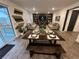 Open-concept living and dining area with modern decor and wood accents at 2089 S Fultondale Way, Aurora, CO 80018
