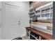 Functional mudroom with built-in bench, shoe storage, and decorative wall accents at 2089 S Fultondale Way, Aurora, CO 80018