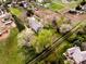 Aerial view showcasing property, lush landscaping, sports court, and horse pasture at 5425 S University Blvd, Greenwood Village, CO 80121