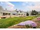 Expansive backyard featuring a fire pit area, outdoor seating, and manicured lawn at 5425 S University Blvd, Greenwood Village, CO 80121