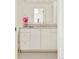 Bright bathroom with white vanity, ample counter space, and large mirror reflecting a well-lit interior at 5425 S University Blvd, Greenwood Village, CO 80121