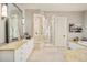 Luxury bathroom with a walk-in shower, soaking tub, and double vanity at 5425 S University Blvd, Greenwood Village, CO 80121