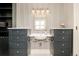 Modern bathroom featuring dual vanities, sophisticated lighting, and chic decor for a luxurious feel at 5425 S University Blvd, Greenwood Village, CO 80121