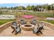 Outdoor fire pit area with Adirondack chairs and view of horses in pasture at 5425 S University Blvd, Greenwood Village, CO 80121