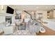 Open-concept living room with a fireplace and staircase at 5425 S University Blvd, Greenwood Village, CO 80121