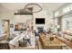 Inviting living room with fireplace, comfortable seating, high ceilings, and large windows offering ample natural light at 5425 S University Blvd, Greenwood Village, CO 80121