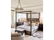 Bright and spacious main bedroom with a large bed and elegant lighting at 5425 S University Blvd, Greenwood Village, CO 80121