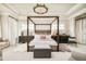 Spacious main bedroom with a four-poster bed and sophisticated decor at 5425 S University Blvd, Greenwood Village, CO 80121