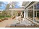 A large patio with fireplace, comfortable seating and stone detailing at 5425 S University Blvd, Greenwood Village, CO 80121