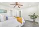 Cozy bedroom with ceiling fan and ample natural light, offering a peaceful retreat at 18751 E Mexico Ave, Aurora, CO 80017