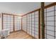 Unique room featuring Japanese-style sliding doors and hardwood floors at 720 16Th St # 505, Denver, CO 80202