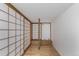 Unique room featuring Japanese-style sliding doors, a wooden platform, and hardwood floors at 720 16Th St # 505, Denver, CO 80202