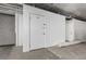 Storage area with numbered doors and roll up garage door at 720 16Th St # 505, Denver, CO 80202