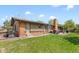 Expansive backyard featuring a well-maintained lawn, patio, and charming home exterior, ideal for outdoor living at 11037 Cambridge Pl, Parker, CO 80138