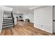 Spacious basement featuring wood floors, stairs, and exercise equipment for a home gym at 11037 Cambridge Pl, Parker, CO 80138