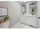 Bathroom featuring a double sink vanity and a marble tile floor at 11037 Cambridge Pl, Parker, CO 80138