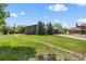 Single Gathering home with lush green lawn, mature trees, and a long driveway at 11037 Cambridge Pl, Parker, CO 80138