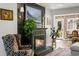 Living room showcasing a decorative fireplace, hardwood floors and bright natural light at 11037 Cambridge Pl, Parker, CO 80138