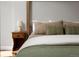 Close up of the linens on a comfortable four poster bed with matching bedside tables at 11037 Cambridge Pl, Parker, CO 80138