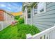 A spacious backyard with a patio, lush greenery, and a privacy fence at 10571 Garfield St, Thornton, CO 80233