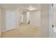 Finished basement area with carpet, white trim, and access to stairs and other rooms at 10571 Garfield St, Thornton, CO 80233