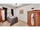 Comfortable bedroom with carpet, window, dresser, and closet at 10571 Garfield St, Thornton, CO 80233