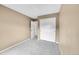 Neutral bedroom showcases ample closet space and a carpeted floor at 10571 Garfield St, Thornton, CO 80233