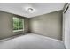 Neutral bedroom showcases a window providing natural light and a closet at 10571 Garfield St, Thornton, CO 80233