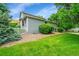 Well-maintained yard with lush green grass surrounding the home at 10571 Garfield St, Thornton, CO 80233