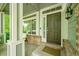 Inviting front porch with a swing, windows, and a charming front door at 10571 Garfield St, Thornton, CO 80233