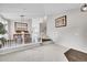 Spacious living room with carpet floors, natural light, and staircase at 10571 Garfield St, Thornton, CO 80233
