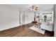 Bright living room is an open space, with modern decor, and wood floors at 10571 Garfield St, Thornton, CO 80233