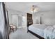 Spacious main bedroom boasts vaulted ceilings, a ceiling fan, stone fireplace, and ensuite access at 10571 Garfield St, Thornton, CO 80233