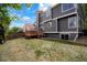Charming backyard featuring a wooden deck, lawn, and attractive home exterior in a residential setting at 10703 Jordan Ct, Parker, CO 80134