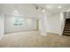 Finished basement with ample space, natural light, and staircase, perfect for versatile use at 10703 Jordan Ct, Parker, CO 80134