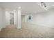 Finished basement space offers versatile living with neutral colors and ample lighting at 10703 Jordan Ct, Parker, CO 80134